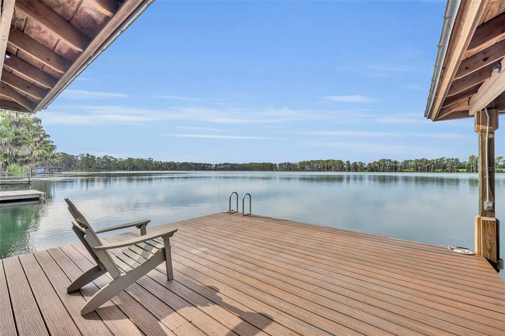 1134 Kelso Boulevard Windermere, FL 34786 - Photo 4 of 37 a lake view with a lake view and a wooden floor