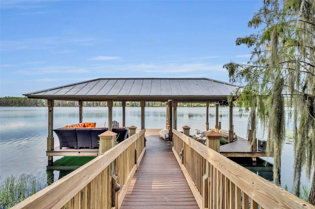 1134 Kelso Boulevard Windermere, FL 34786 - Photo 5 of 37 a view of a balcony and car parked
