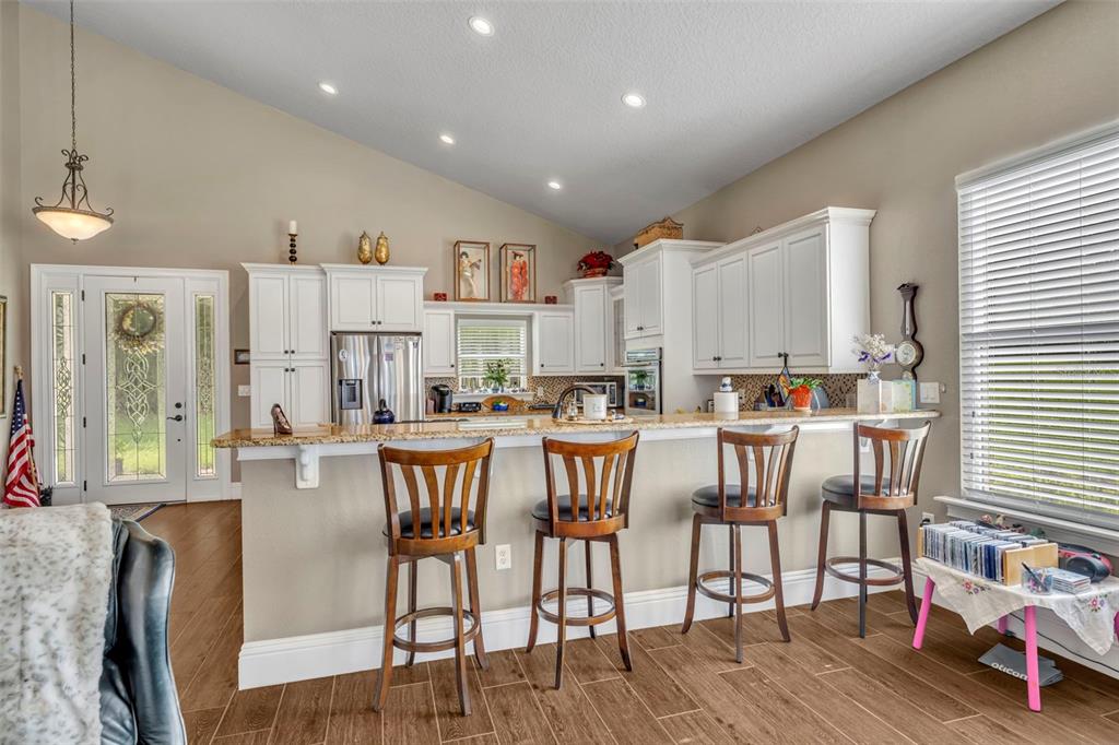 1134 Kelso Boulevard Windermere, FL 34786 - Photo 9 of 37 a large kitchen with lots of furniture and appliances