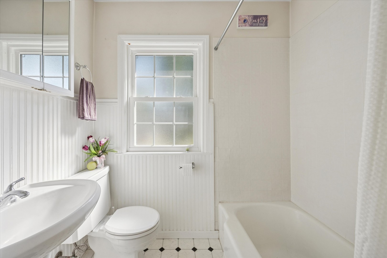 1115 North Main Street Wheaton, IL 60187 - Photo 12 of 28 a bathroom with a sink a toilet and shower