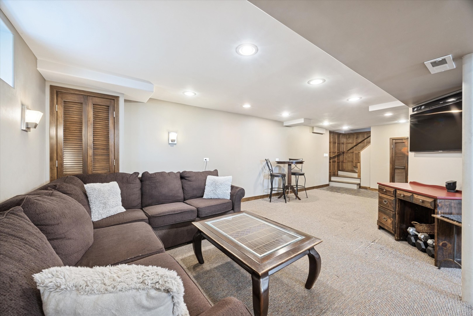 1115 North Main Street Wheaton, IL 60187 - Photo 19 of 28 a living room with furniture and a flat screen tv