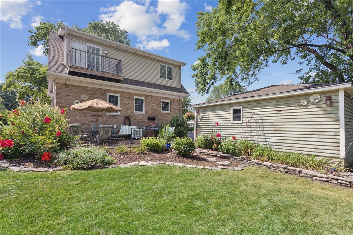1115 North Main Street Wheaton, IL 60187 - Photo 23 of 28 a view of a house with a backyard and garden