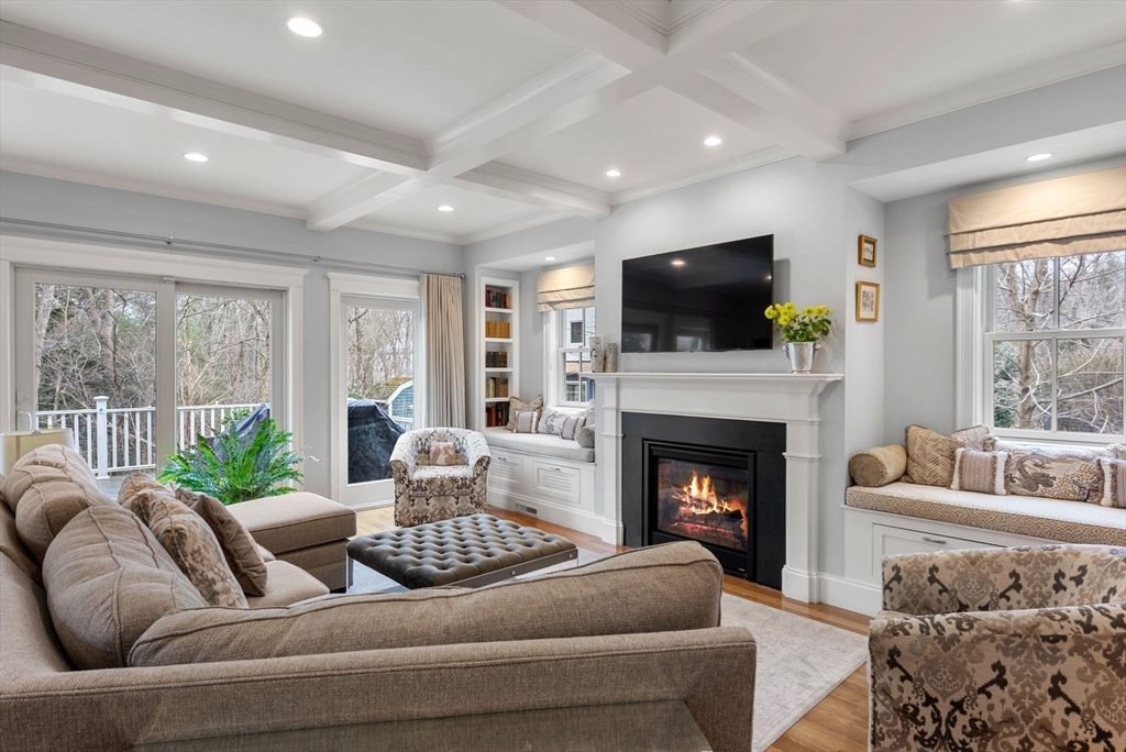 20 Manor Avenue Wellesley, MA 02482 - Photo 11 of 32 a living room with furniture a flat screen tv and a fireplace