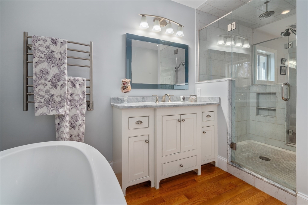 20 Manor Avenue Wellesley, MA 02482 - Photo 18 of 32 a bathroom with a granite countertop sink a mirror and shower