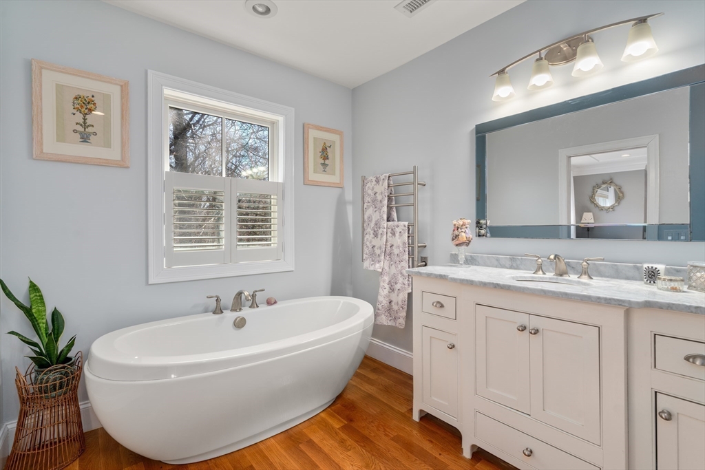 20 Manor Avenue Wellesley, MA 02482 - Photo 19 of 32 a white bath tub sitting next to a bathroom sink