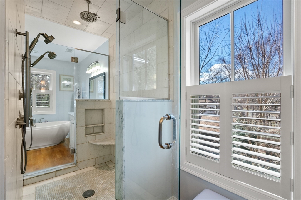 20 Manor Avenue Wellesley, MA 02482 - Photo 20 of 32 a bathroom with a granite countertop sink a mirror and shower
