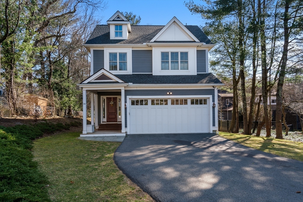 20 Manor Avenue Wellesley, MA 02482 - Photo 2 of 32 a front view of a house with a garden