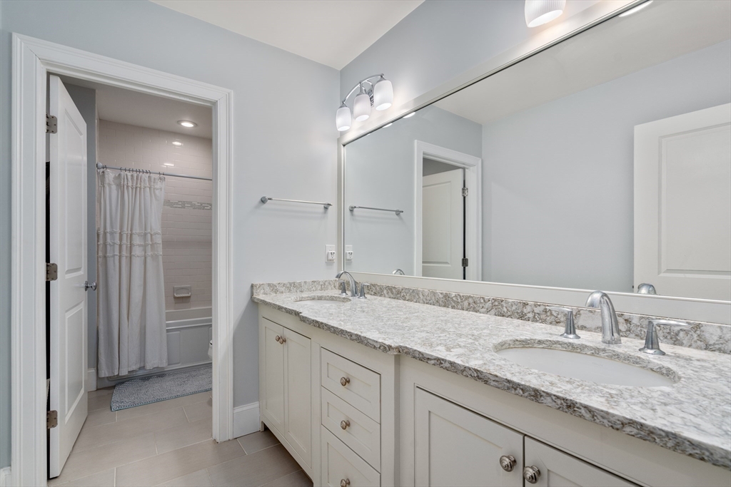 20 Manor Avenue Wellesley, MA 02482 - Photo 24 of 32 a bathroom with a granite countertop sink double and mirror