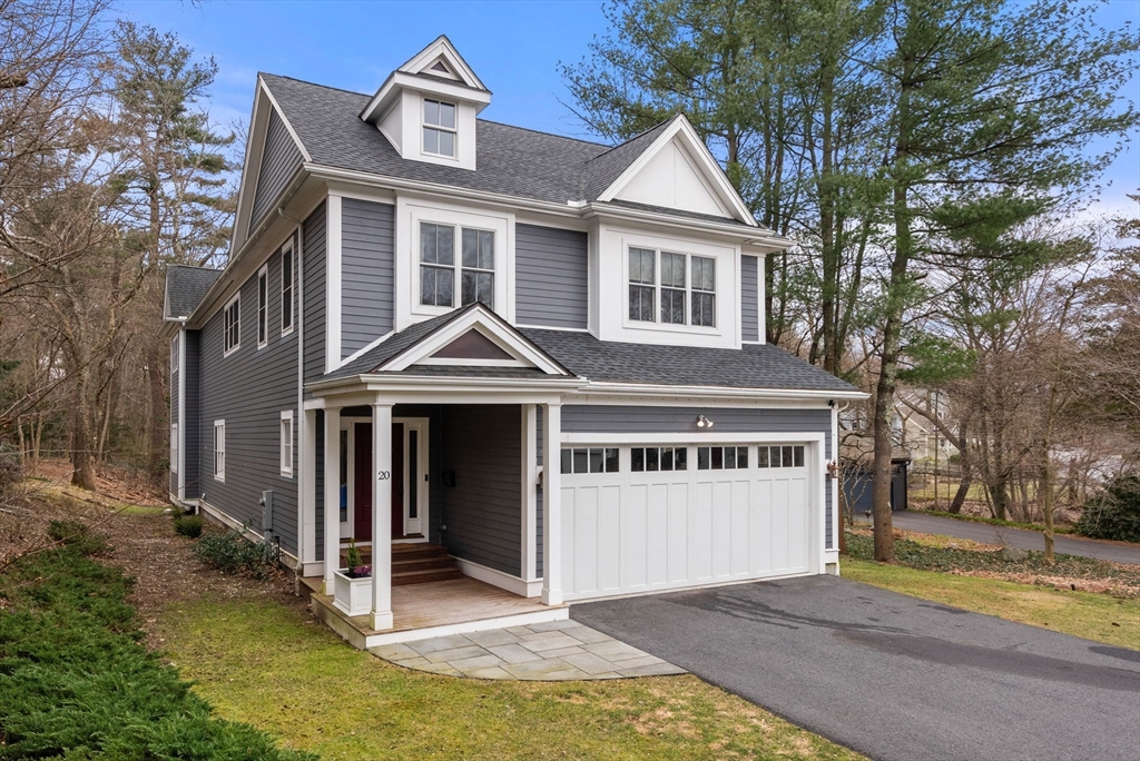 20 Manor Avenue Wellesley, MA 02482 - Photo 32 of 32 a front view of a house with a yard garage and trees