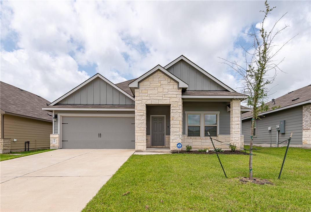 2166 Chief Street Bryan, TX 77807 - Photo 1 of 18 a front view of house with a garden and yard