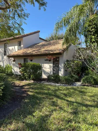 a view of a house with a garden