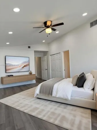 a large kitchen with cabinets and stainless steel appliances