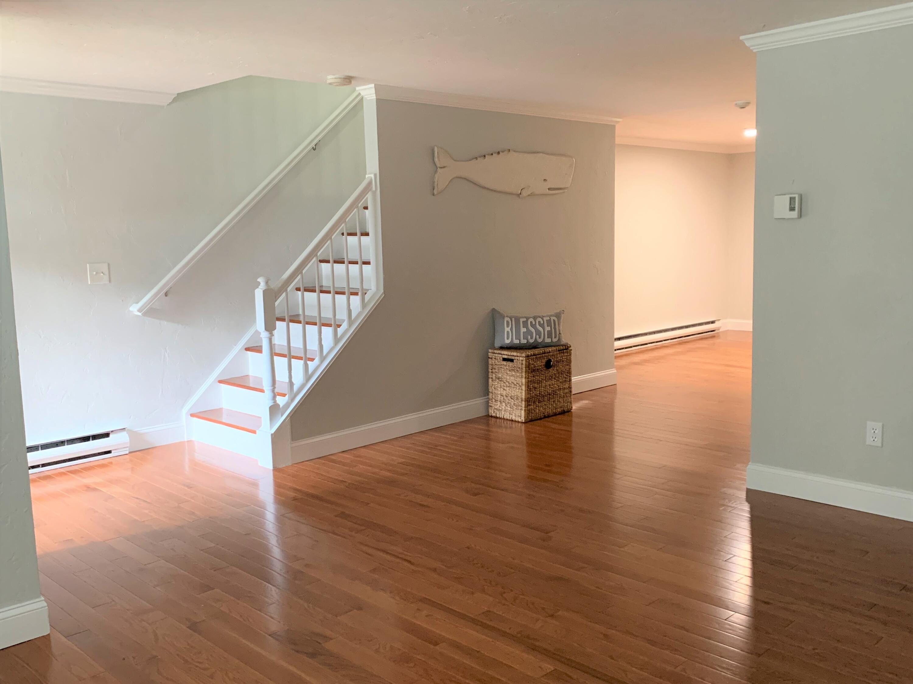 195 Falmouth Road, Unit 19D Mashpee, MA 02649 - Photo 3 of 17 a view of entryway and hall with wooden floor