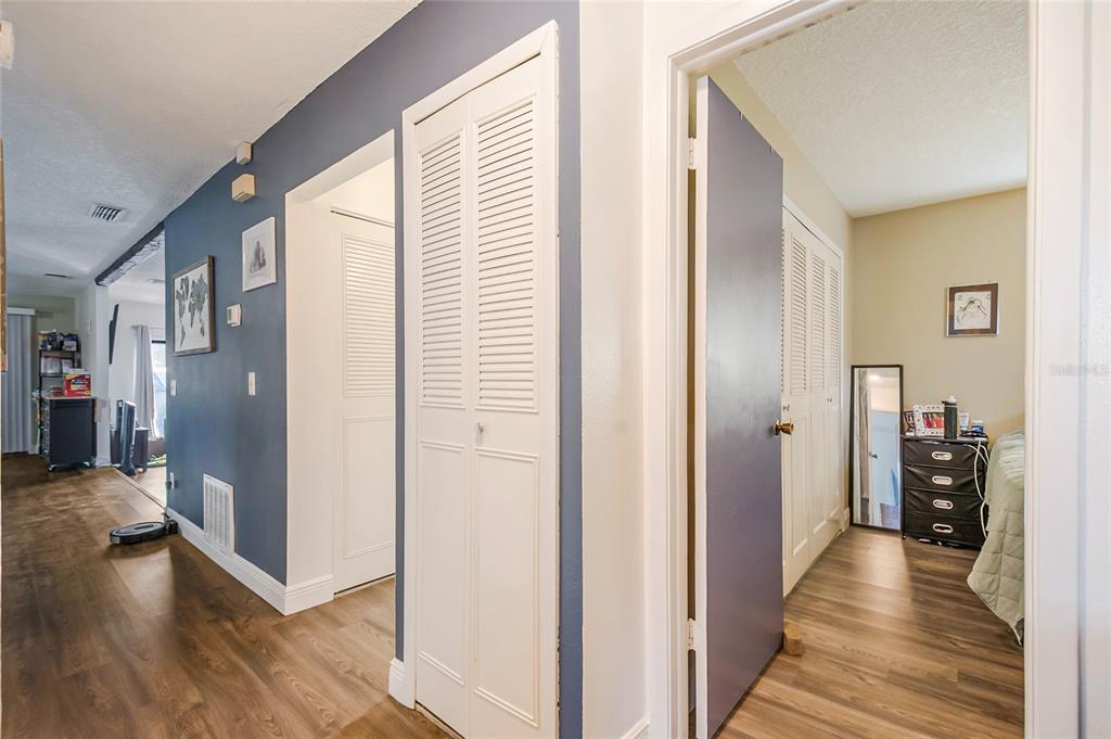 4432 Watch Hill Road Orlando, FL 32808 - Photo 17 of 30 a view of a hallway with wooden floor and staircase