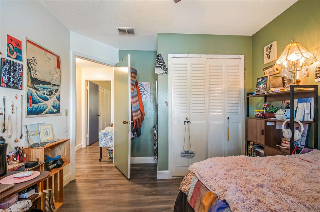 4432 Watch Hill Road Orlando, FL 32808 - Photo 26 of 30 a bedroom with a bed and a window