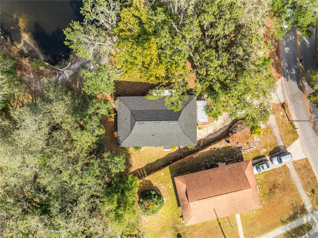 4432 Watch Hill Road Orlando, FL 32808 - Photo 27 of 30 an aerial view of a house with a yard and trees