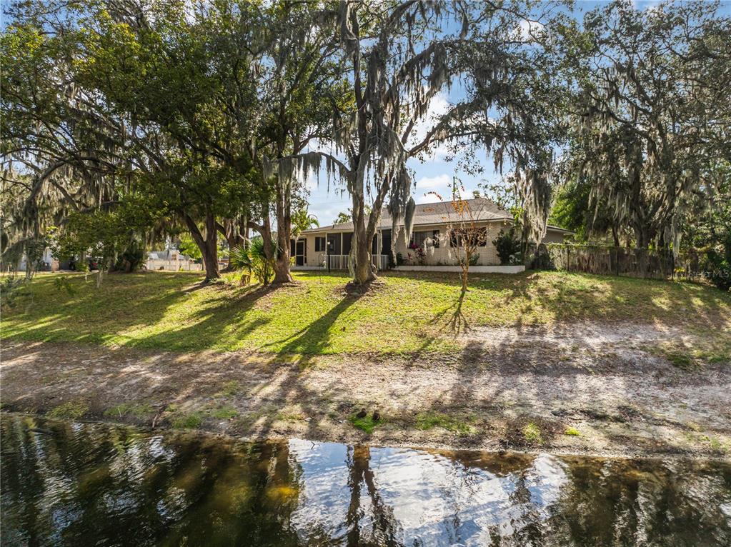 4432 Watch Hill Road Orlando, FL 32808 - Photo 28 of 30 a view of a house with swimming pool and sitting area