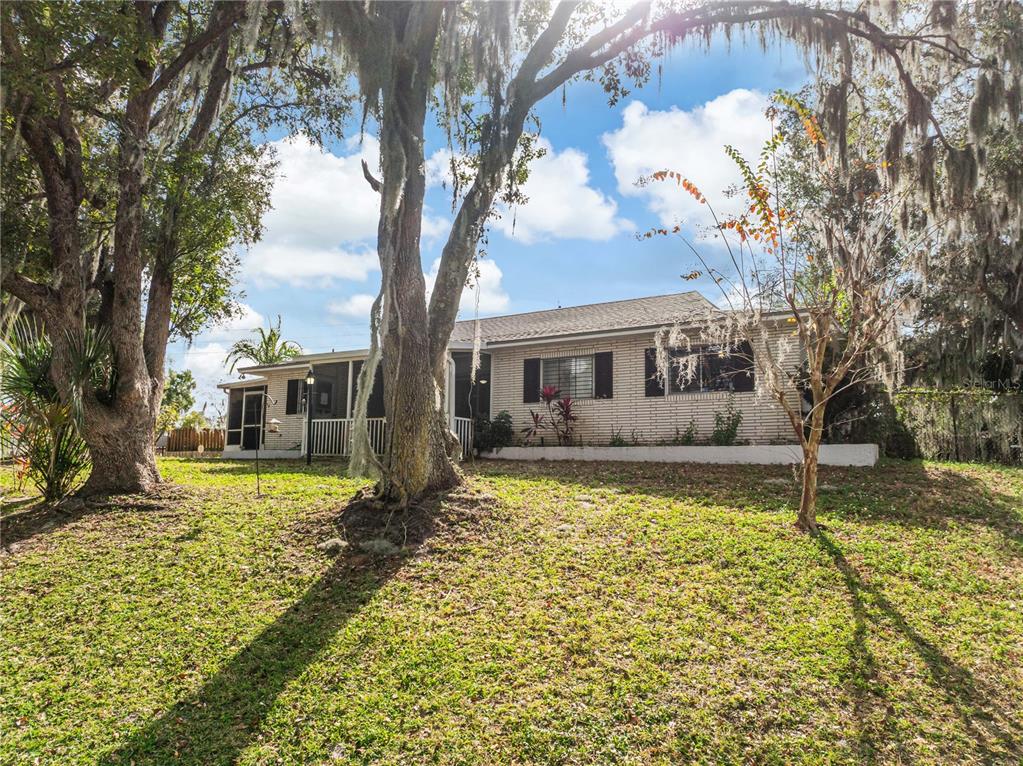 4432 Watch Hill Road Orlando, FL 32808 - Photo 4 of 30 a front view of a house with a yard