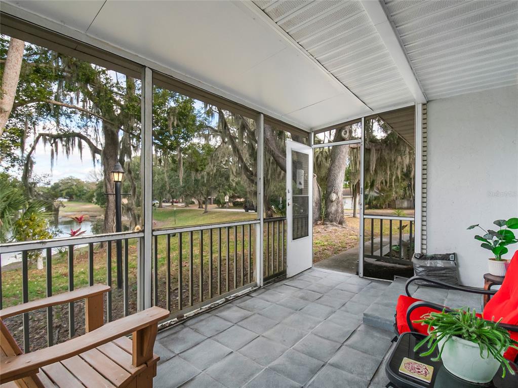 4432 Watch Hill Road Orlando, FL 32808 - Photo 5 of 30 a balcony with furniture and garden view