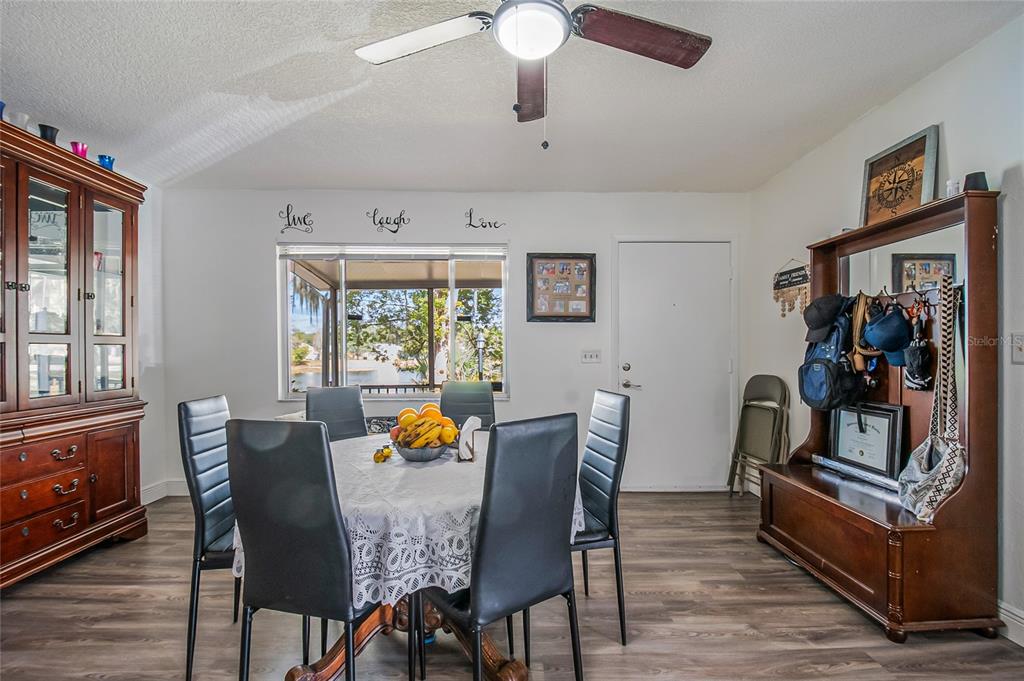 4432 Watch Hill Road Orlando, FL 32808 - Photo 7 of 30 a dining room with furniture and window