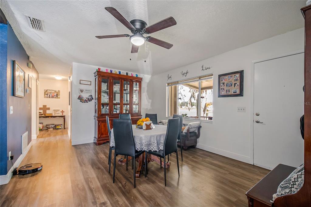 4432 Watch Hill Road Orlando, FL 32808 - Photo 9 of 30 a view of a dining room with furniture window and wooden floor