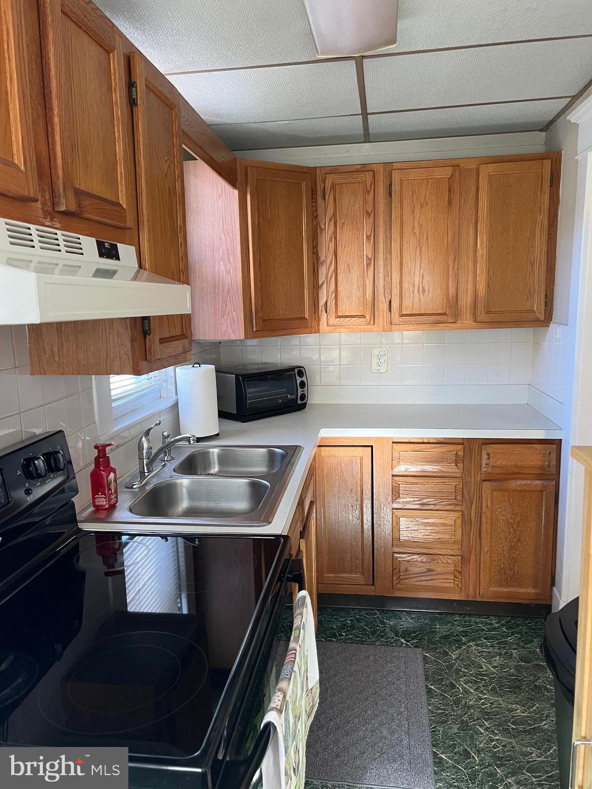 3204 Elizabeth Avenue Baltimore, MD 21227 - Photo 14 of 29 Compact but Convenient Kitchen