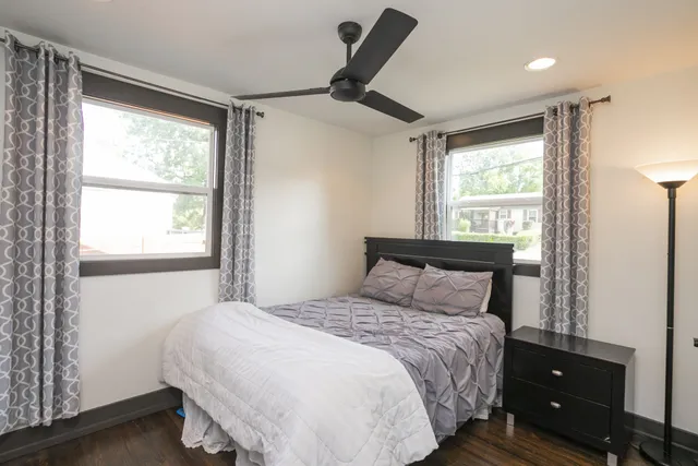 a bedroom with a bed and a window