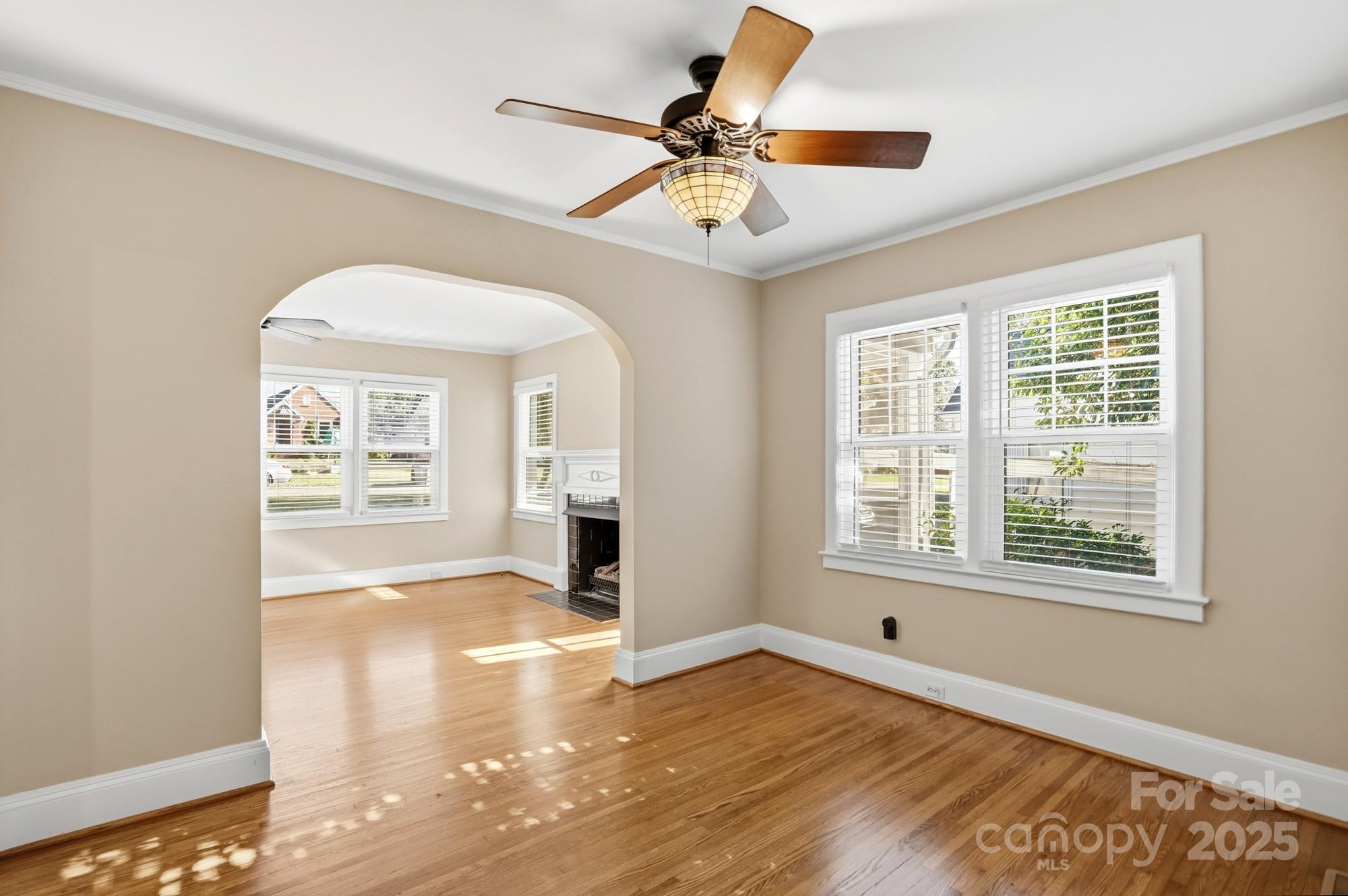 3108 Westmoreland Avenue Charlotte, NC 28205 - Photo 4 of 27 a view of an empty room with window and wooden floor