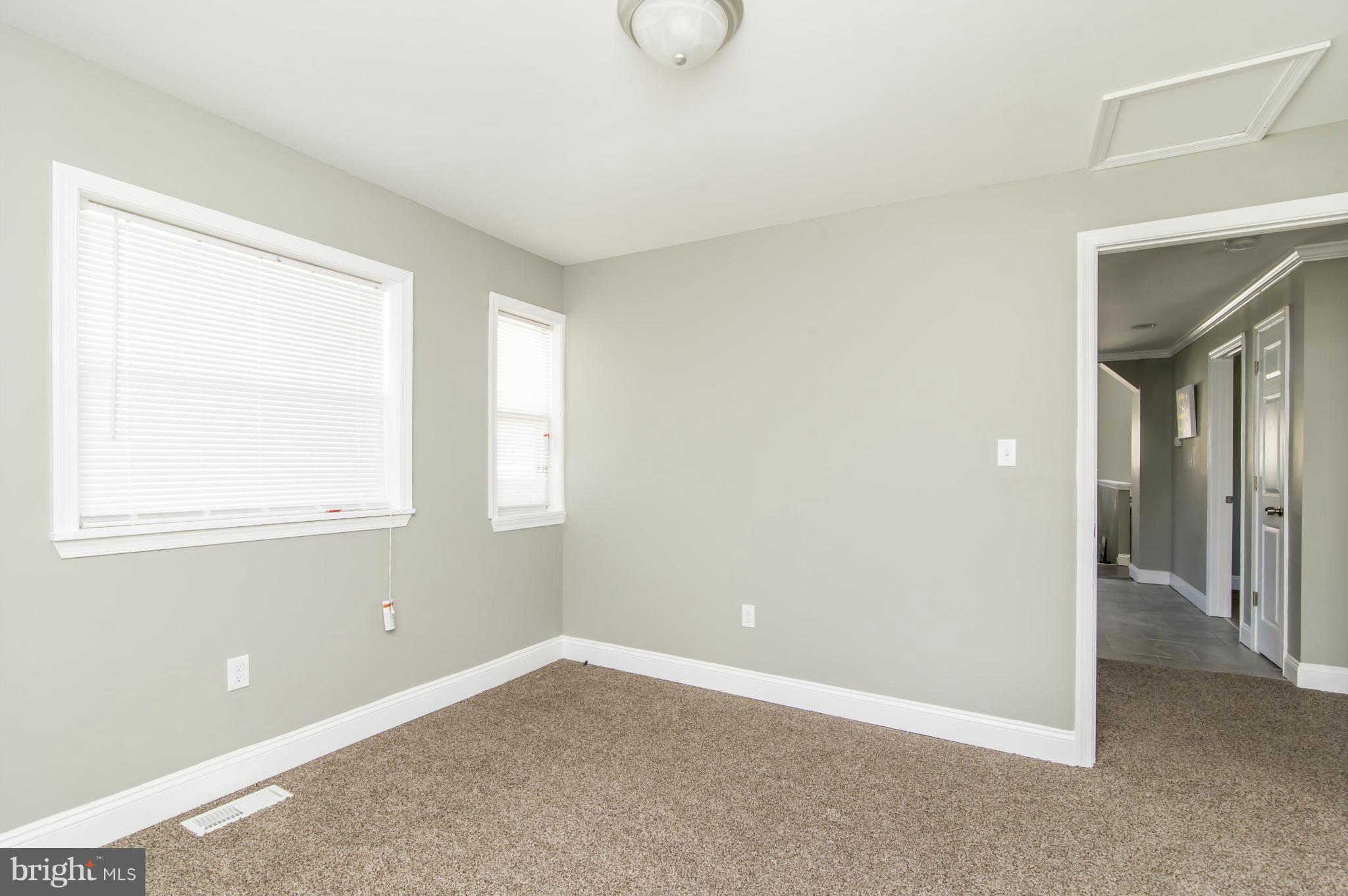 1210 3rd Road Baltimore, MD 21220 - Photo 18 of 26 an empty room with windows