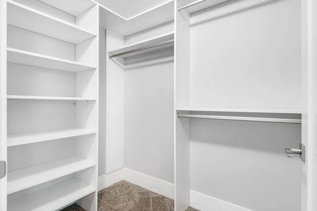 a view of an empty walk in closet