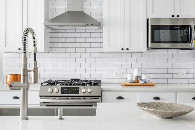 a kitchen with a stove and a microwave