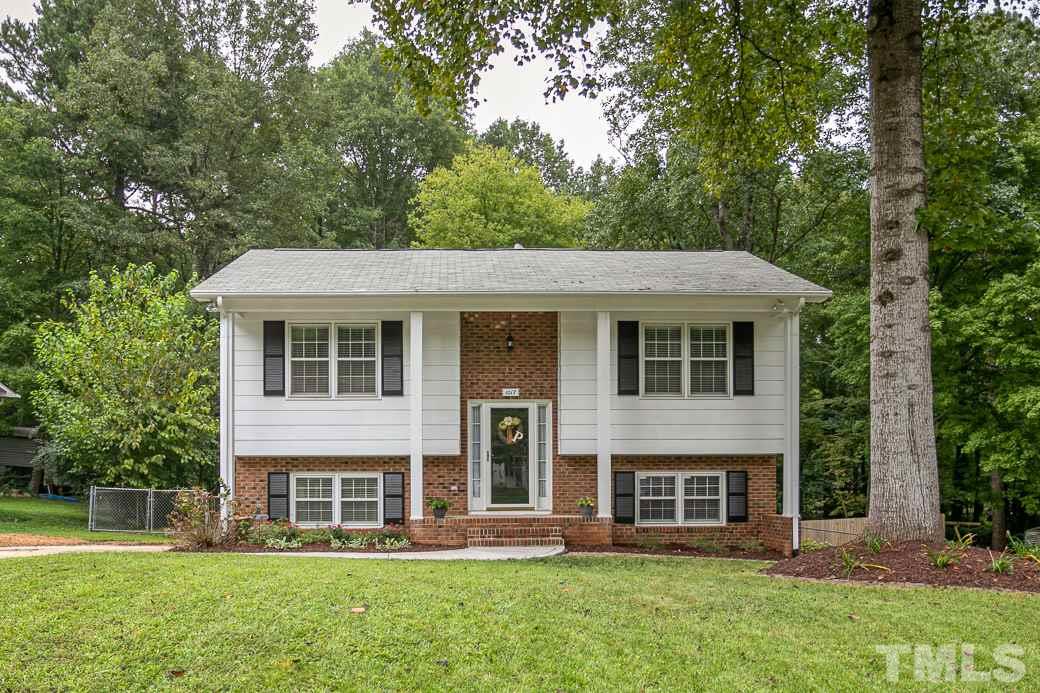 1017 Mockingbird Drive Raleigh, NC 27615 - Photo 1 of 12 Beautifully UPDATED KITCHEN & BATH home in North Raleigh with NEW 2019 HVAC! Head out back to relax on the patio overlooking the fenced, wooded yard with shed. New Kitchen has GRANITE counter tops, SS appliances, white cabinetry & tiled backsplash.