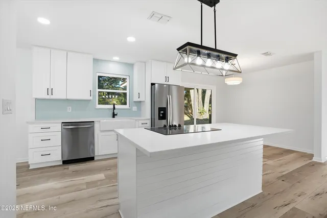 a kitchen with a stove and a sink