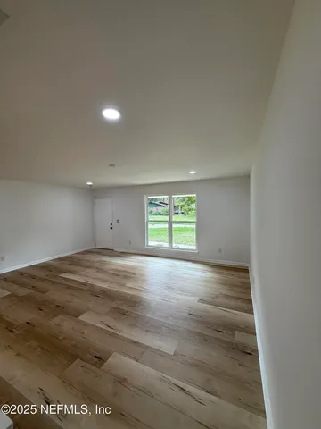 a view of a backyard with large trees