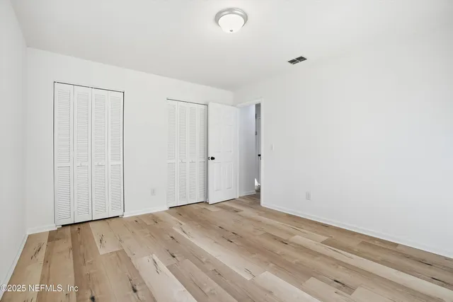 a bathroom with a sink a toilet and shower curtain