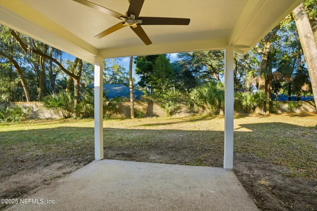 a view of yard with large tree
