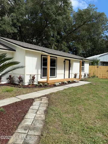 a bathroom with a toilet a sink and a shower