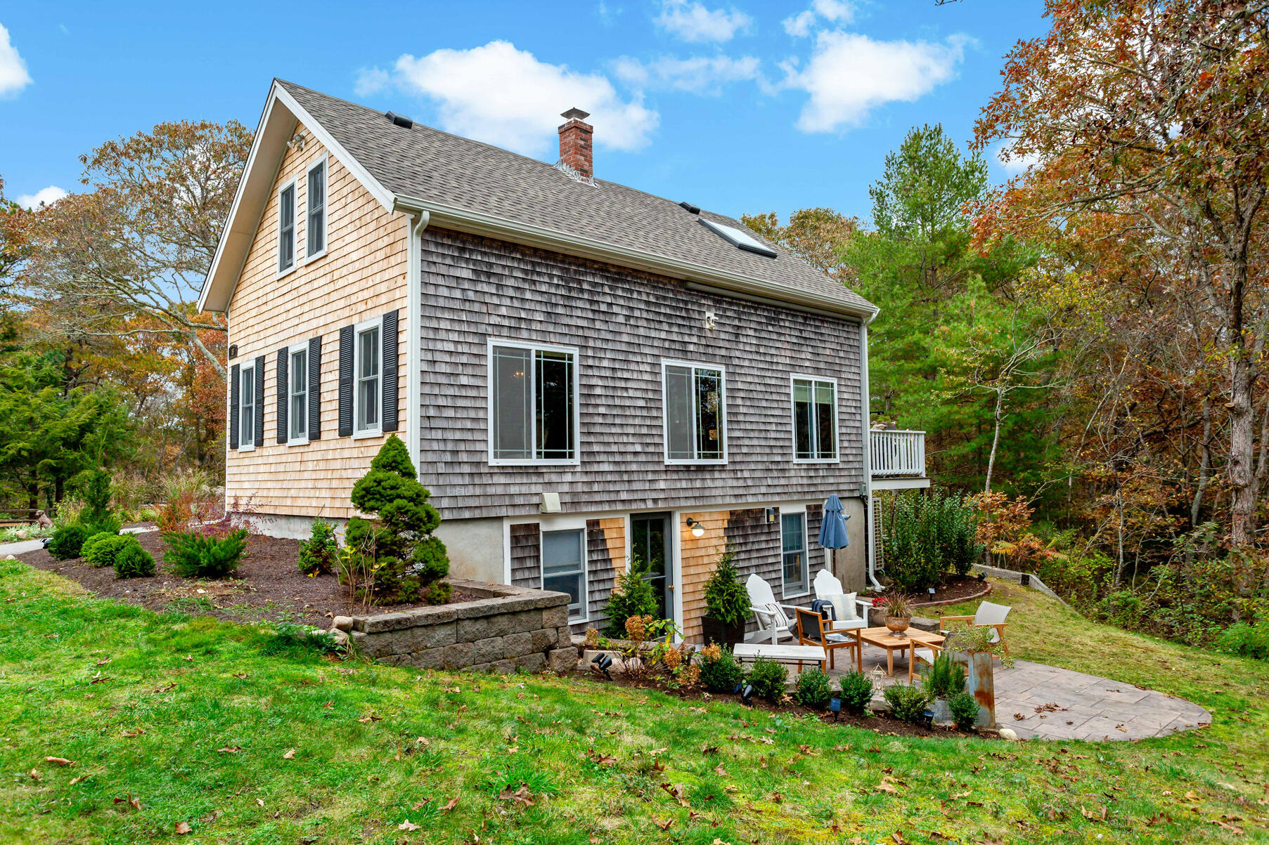 18 Evsun Drive Sandwich, MA 02563 - Photo 2 of 39 a front view of house with a garden and patio