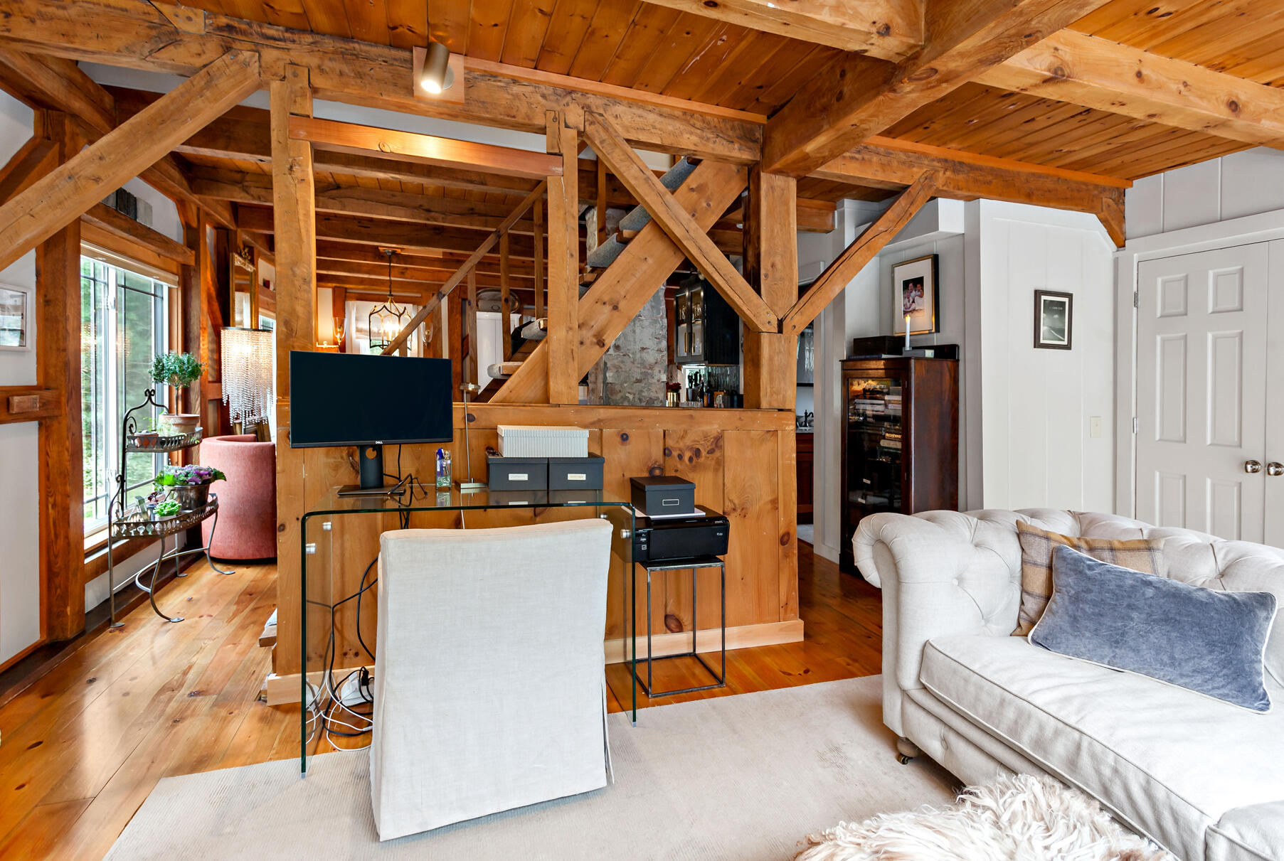 18 Evsun Drive Sandwich, MA 02563 - Photo 8 of 39 a living room with furniture a flat screen tv and a table