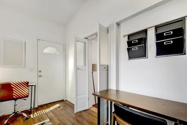 a view of a livingroom with furniture and wooden floor