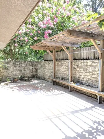 a view of a yard with a tree