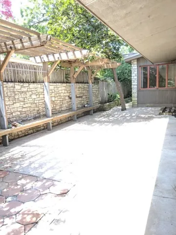 a view of a backyard of the house