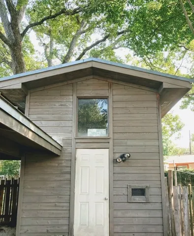 a side view of a house with a window