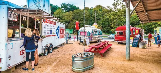 a outdoor space with lots of potted plants