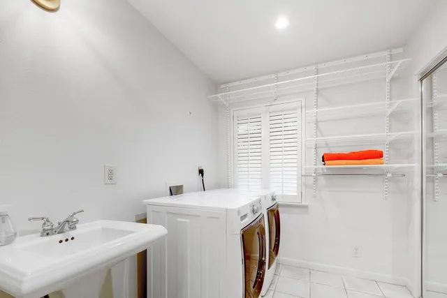 a utility room with dryer and washer