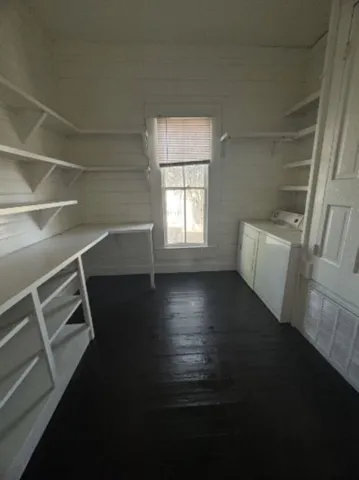 a view of room with window and hardwood floor