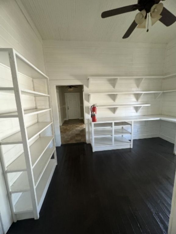 302 South Burleson Street Kyle, TX 78640 - Photo 12 of 18 a view of walk in closet with empty racks