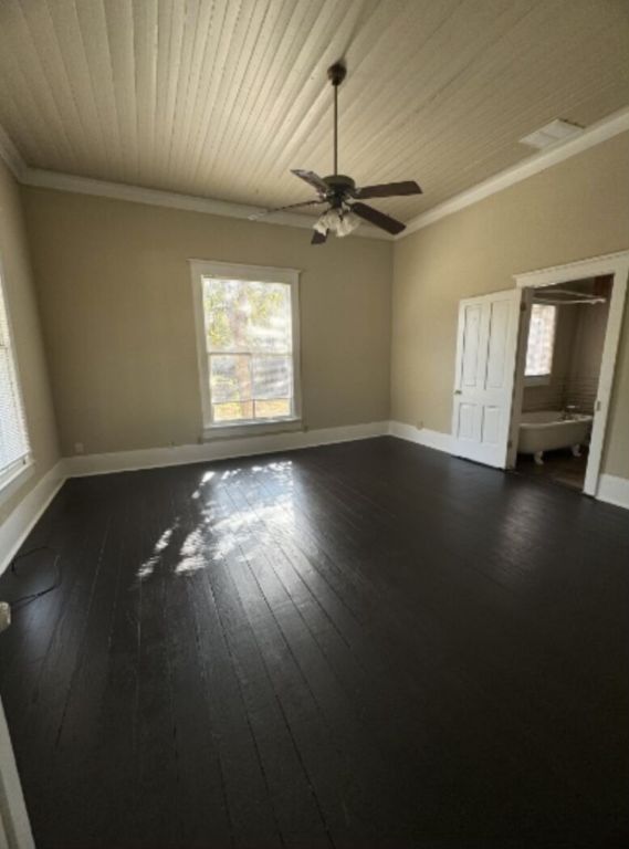 302 South Burleson Street Kyle, TX 78640 - Photo 17 of 18 a view of empty room with wooden floor and fan