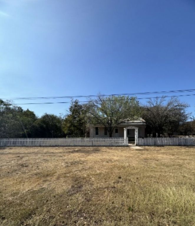 302 South Burleson Street Kyle, TX 78640 - Photo 2 of 18 a view of a swimming pool with an ocean and mountain view