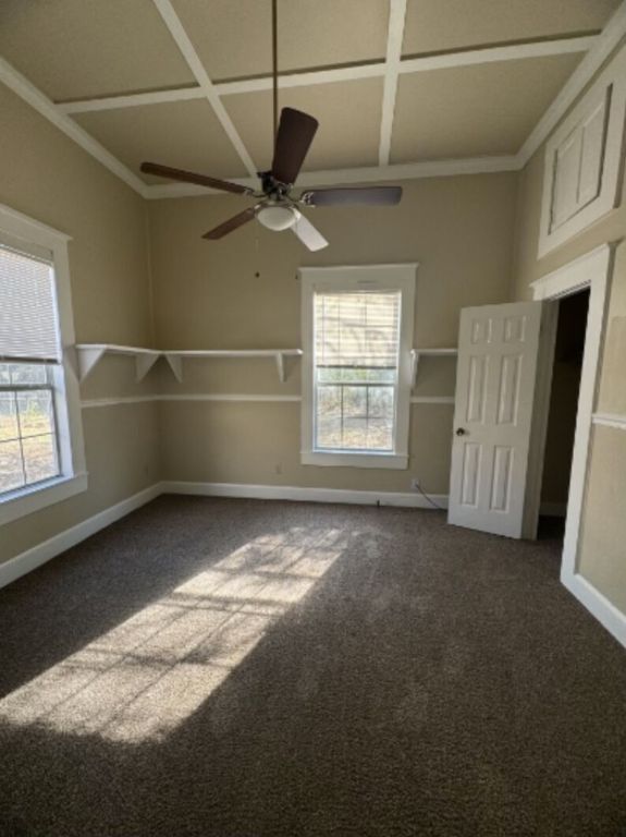 302 South Burleson Street Kyle, TX 78640 - Photo 5 of 18 an empty room with windows